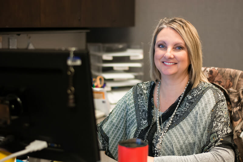 Cornerstone Bank staff working at her computer