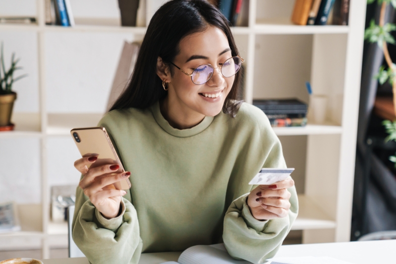 Girl looking at debit card